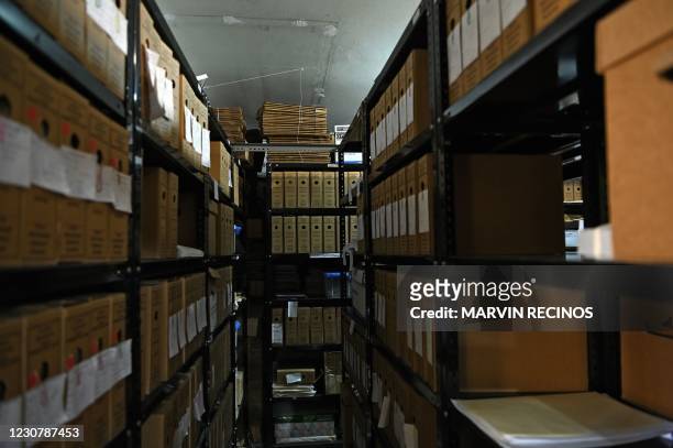 Picture of archives containing information on the El Mozote massacre and surrounding sites, seen at the headquarters of the Archbishopric of San...