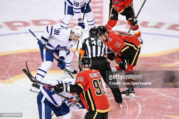 Toronto Maple Leafs Center John Tavares and Calgary Flames Center Mikael Backlund get set for a face-off during the second period of an NHL game...