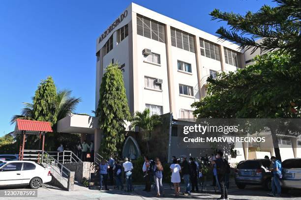 Journalists wait outside the headquarters of the San Salvador Archbishopric while San Francisco Gotera's investigating judge Jorge Guzman, along with...