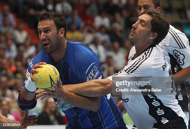 Igor Vori of Hamburg scores against Marcus Ahlm of Kiel during the Handball Supercup match between HSV Hamburg and THW Kiel on August 30, 2011 in...