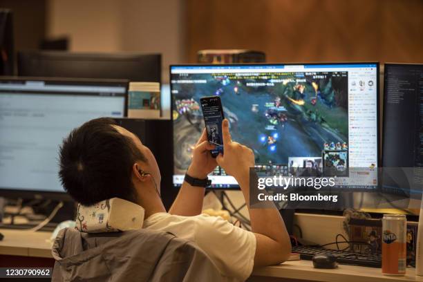 An employee rests during lunch break at XD Inc.'s office in Shanghai, China, on Thursday, Jan. 21, 2021. Shares in indie game distributor XD rose 24%...