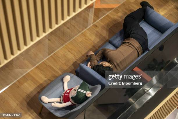 An employee rests at XD Inc.'s office in Shanghai, China, on Thursday, Jan. 21, 2021. Shares in indie game distributor XD rose 24% on the first...