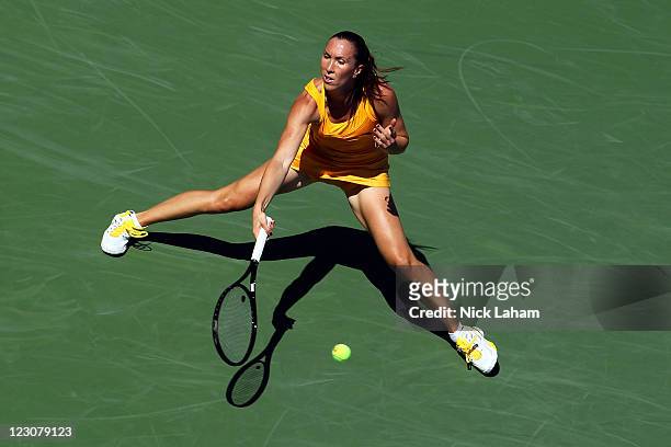 Jelena Jankovic of Serbia returns a shot against Alison Riske of the United States during Day Two of the 2011 US Open at the USTA Billie Jean King...