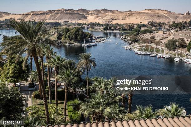 This picture taken on January 3, 2021 shows a view of Aswan from the Old Cataract Hotel overlooking the Nile river in Egypt's southern city of Aswan,...