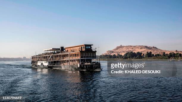 This picture taken on January 3, 2021 shows the steam ship "PS Sudan" cruising along the Nile river by Egypt's southern city of Aswan, some 920...