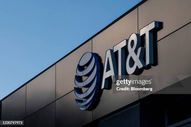 Signage on an AT&T store in Daly City, California, U.S., on Monday, Jan. 25, 2021. AT&T Inc. Is expected to release earnings figures on January 27....