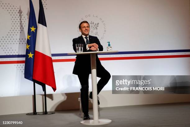 French President Emmanuel Macron attends a video conference at the Elysee Palace in Paris on January 26 as part of World Economic Forum which usually...