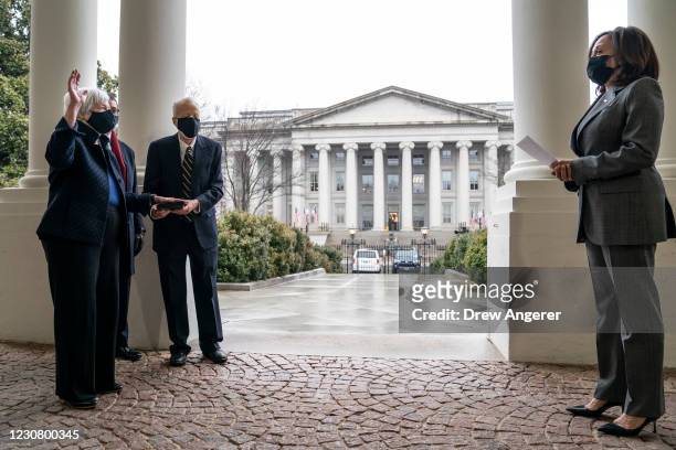 With the U.S. Treasury Building behind them, U.S. Vice President Kamala Harris participates in a ceremonial swearing-in of new Treasury Secretary...