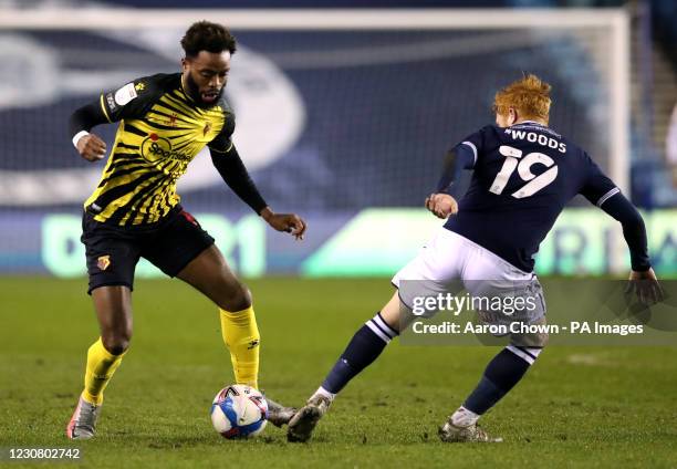 Watford's Nathaniel Chalobah and Millwall's Ryan Woods battle for the ball during the Sky Bet Championship match The Den, London. Picture date:...