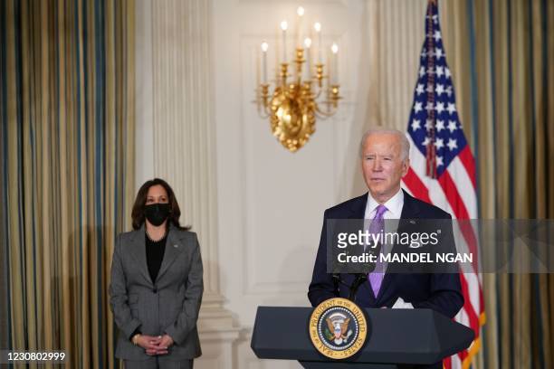 President Joe Biden arrives to speak on racial equity with US Vice President Kamala Harris before signing executive orders in the State Dining Room...