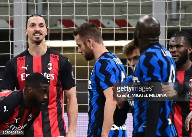 Milan's Swedish forward Zlatan Ibrahimovic argues with Inter Milan's Belgian forward Romelu Lukaku at the end of the first half of the Italian Cup...