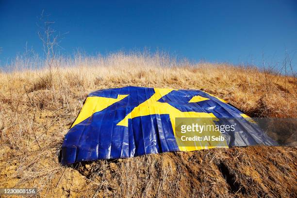 Before sunrise a hiker placed a large plastic tarp painted to reflect the Kobe Bryant number 24 on The New Millennium Loop Trail near the Bark Park...
