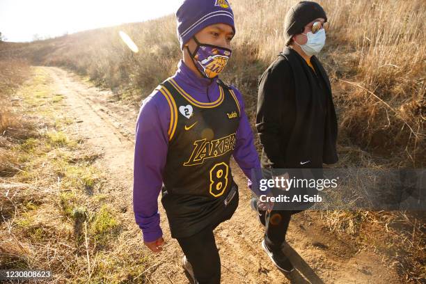 Bernard Tolentino left, from La Puente with Mario Luna of East LA hike down from the mountainside in Calabasas after hiking to the exact location...