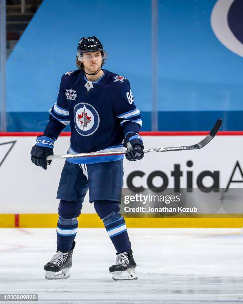 Nathan Beaulieu of the Winnipeg Jets keeps an eye on the play during third period action against the Edmonton Oilers at the Bell MTS Place on January...