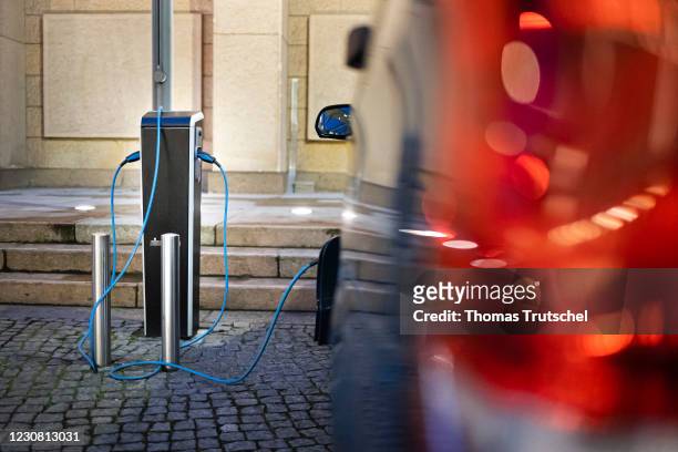 Symbolic photo on the subject of electromobility: An electric car is charged at a charging station on January 26, 2021 in Berlin, Germany.