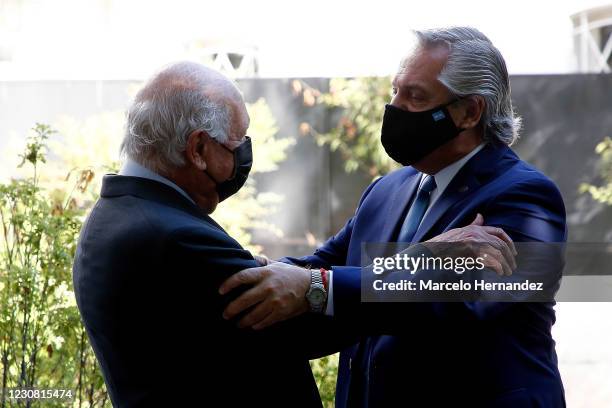 President of Argentina Alberto Fernandez greets former Chilean president Ricardo Lagos before a meeting at Democracia y Desarrollo Foundation on...