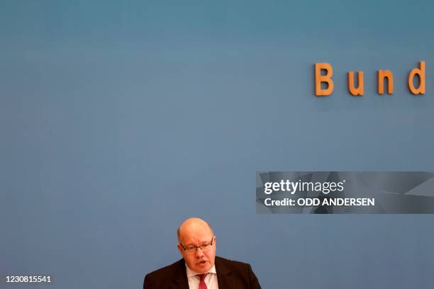 German Economy Minister Peter Altmaier addresses a press conference on the annual economic report in Berlin on January 27, 2021. - The German...