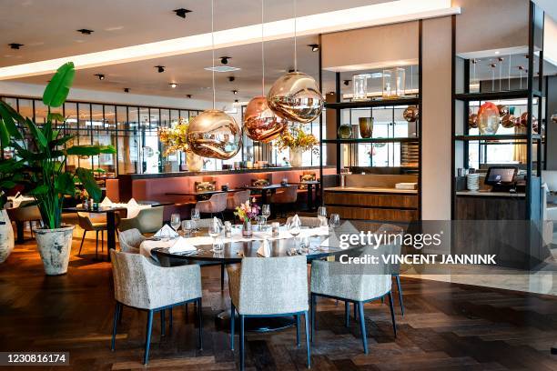 Picture shows an empty restaurant in the Van der Valk hotel in Enschede on January 27 closed as part of measures taken to curb the spread of the...