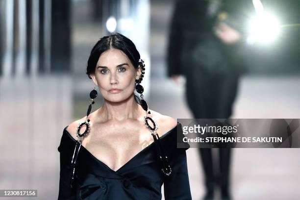 Actress Demi Moore presents a creation of British designer Kim Jones for the Fendi's Spring-Summer 2021 collection during the Paris Haute Couture...