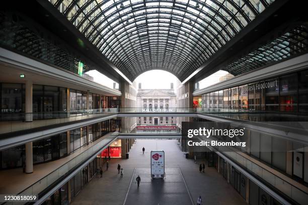 Pedestrians pass through the atrium of the Mall of Berlin near the Bundesrat federal council building in Berlin, Germany, on Wednesday, Jan. 27,...