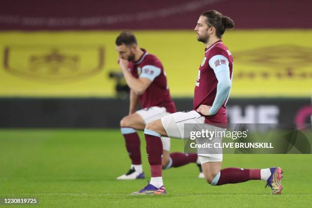 Burnley's English striker Jay Rodriguez takes a knee against racism before kick off of the English Premier League football match between Burnley and...