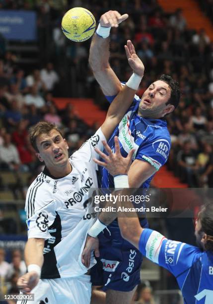 Igor Vori of Hamburg is challenged by Momir Ilic of Kiel during the Handball Supercup match between HSV Hamburg and THW Kiel on August 30, 2011 in...