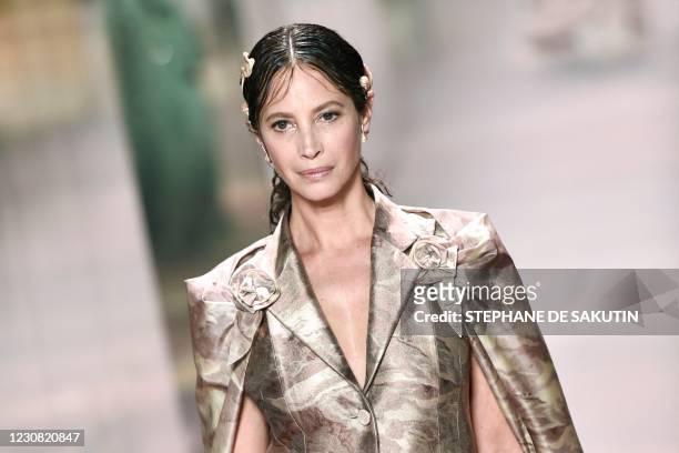 Model Christy Turlington presents a creation of British designer Kim Jones for the Fendi's Spring-Summer 2021 collection during the Paris Haute...