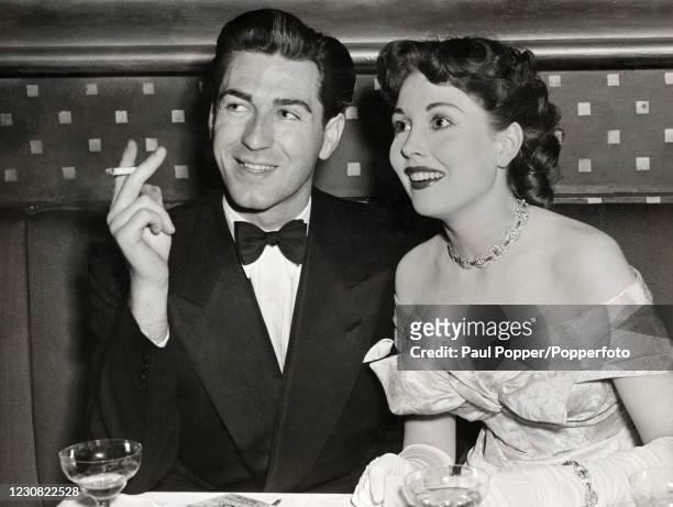 Dermot Walsh and Hazel Court, film actors and soon-to-be husband and wife, at The Bagatelle in London, circa 1949.
