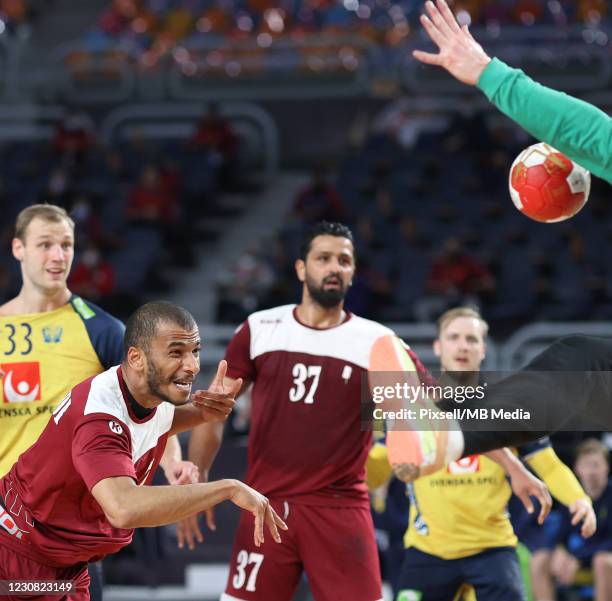 Ahmad Madadi of Qatar throws a goal during the 27th IHF Men's World Championship Quarter Final match between Sweden and Qatar at Cairo Stadium Sports...