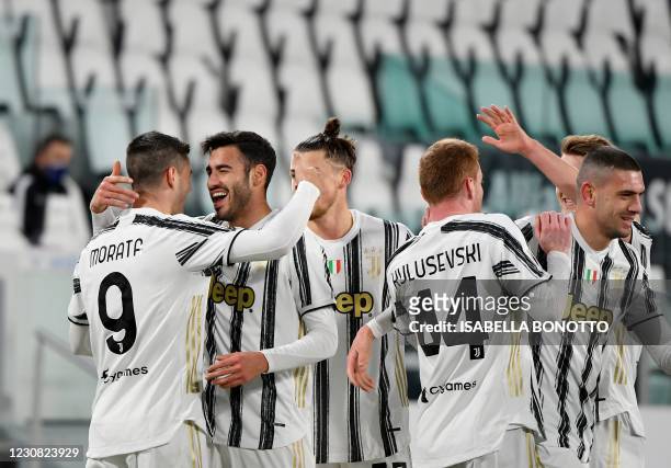 Juventus' Italian defender Gianluca Frabotta celebrates with teammates after scoring a goal during the Italian Cup quarter final football match...