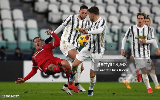 Salvatore Esposito of SPAL challenged by Adrien Rabiot of Juventus during the Coppa Italia match between Juventus and SPAL at Allianz Stadium on...