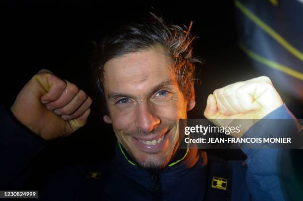 French skipper Charlie Dalin reacts after sailing his Imoca 60 monohull "Apivia" across the finish line in the 2020/2021 ninth edition of the Vendee...