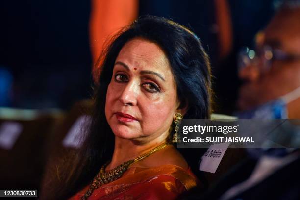 In this picture taken in Mumbai on January 27 Bollywood actress-turned-politician Hema Malini attends the unveiling of anthems for Bharatiya Janata...