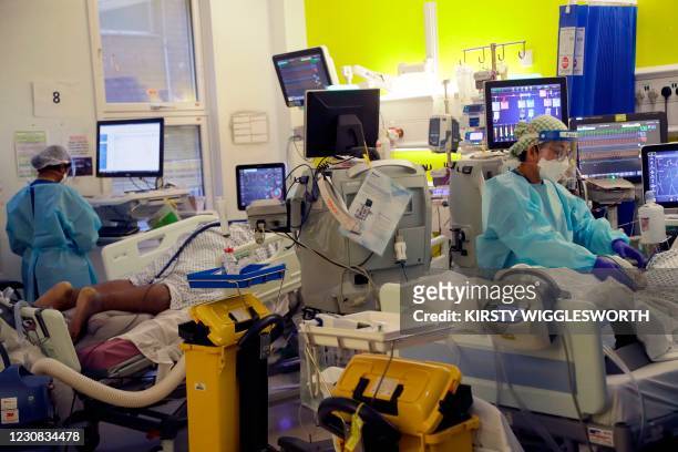 Critical Care staff take care of Covid-19 patients on the Christine Brown ward at King's College Hospital in London on January 27, 2021. - The scale...