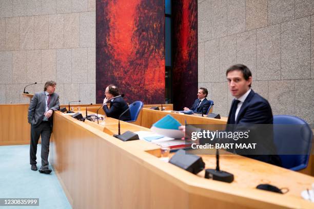 Resigning ministers Wouter Koolmees , Bas van't Wout and Wopke Hoekstra are seen during a debate in the Lower House about the expansion of the...