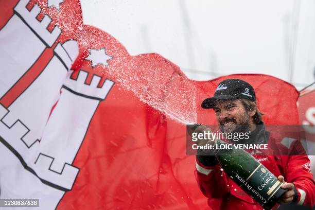 German skipper Boris Herrmann celebrates after crossing the finish line of the Vendee Globe round-the-world solo sailing race, at Les Sables...