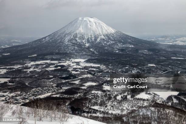 Mount Yotei, a 1,898 metre-high active stratovolcano, looms over the landscape on January 28, 2021 in Niseko, Japan. As one of Asias most popular ski...