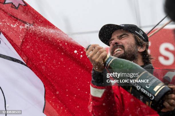 German skipper Boris Herrmann celebrates after crossing the finish line of the Vendee Globe round-the-world solo sailing race, at Les Sables...
