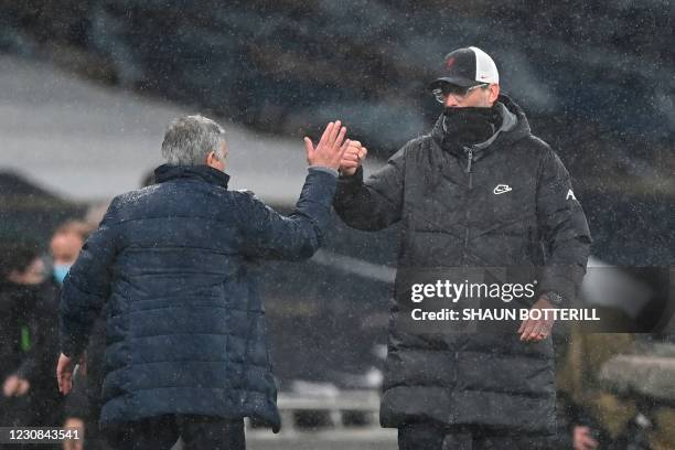 Tottenham Hotspur's Portuguese head coach Jose Mourinho greets Liverpool's German manager Jurgen Klopp at the end of the English Premier League...