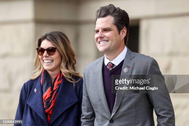 Rep. Matt Gaetz walks with his fiancee Ginger Luckey before speaking to a crowd during a rally against Rep. Liz Cheney on January 28, 2021 in...