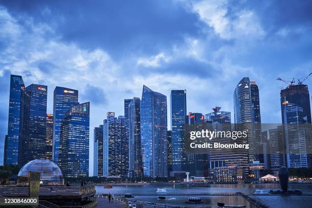 Buildings are illuminated at dusk in the central business district of Singapore, on Thursday, Jan. 28, 2021. HSBC Holdings Plc plans to accelerate...