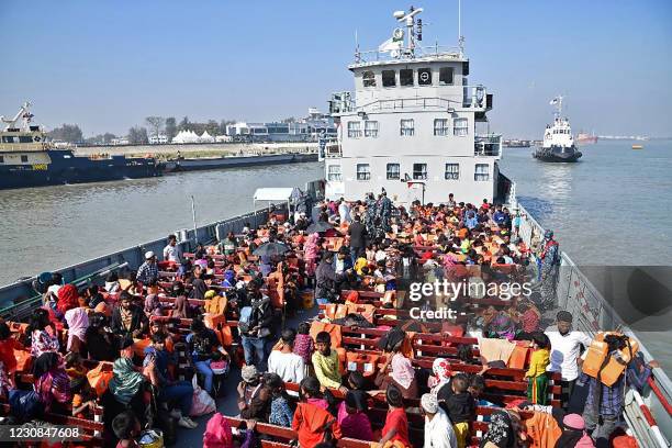 Rohingya refugees are seen on a Bangladesh's Navy ship as they are being relocated to Bhashan Char Island in the Bay of Bengal, in Chittagong on...