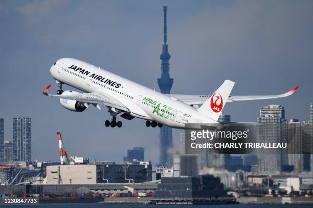 Japan Airlines Airbus A350 passenger aircraft takes off from Tokyo's Haneda airport on January 29, 2021.