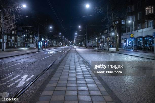 Empty and quiet streets of the Dutch city of Amsterdam during the COVID curfew. People can be out only with a proven reason and special permission...