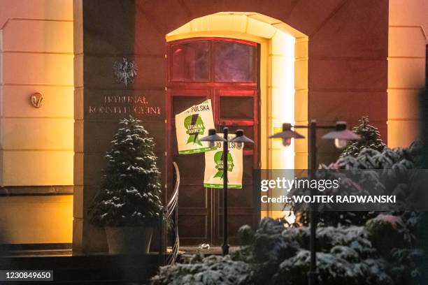 Women's Strike posters are seen attached to the doors of the constitutional court in Warsaw after a few demonstrators maneged to jump over the fence...