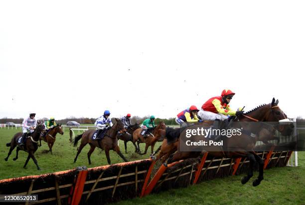 The Edgar Wallace ridden by David Bass clears a fence as they compete in the Sporting Life EBF 'National Hunt' Maiden Hurdle at Doncaster Racecourse...