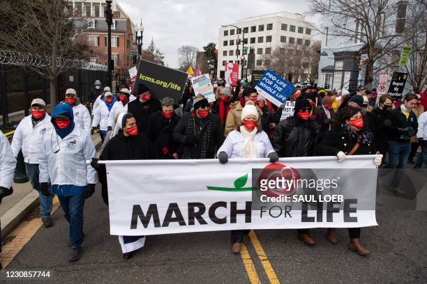 Anti-abortion activists participate in the "March for Life," an annual event to mark the anniversary of the 1973 Supreme Court case Roe v. Wade,...