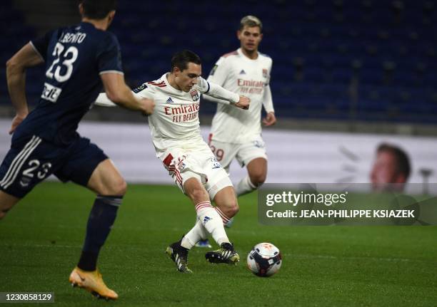 Bordeaux's Swiss defender Loris Benito fights for the ball withLyon's French midfielder Maxence Caqueret during the French L1 football match between...