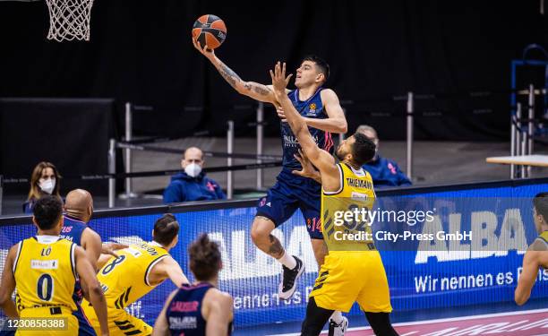 Gabriel Deck of Real Madrid and Johannes Thiemann of Alba Berlin during the Basketball EuroLeague match between Alba Berlin and Real Madrid at...