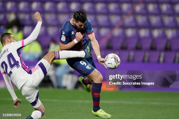 Rafa Mir of SD Huesca scores the first goal to make it 0-1 Joaquin Fernandez of Real Valladolid during the La Liga Santander match between Real...